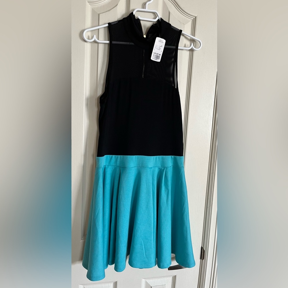 Forever 21 cute dress. Turquoise skirt and black/sheer top. Size large